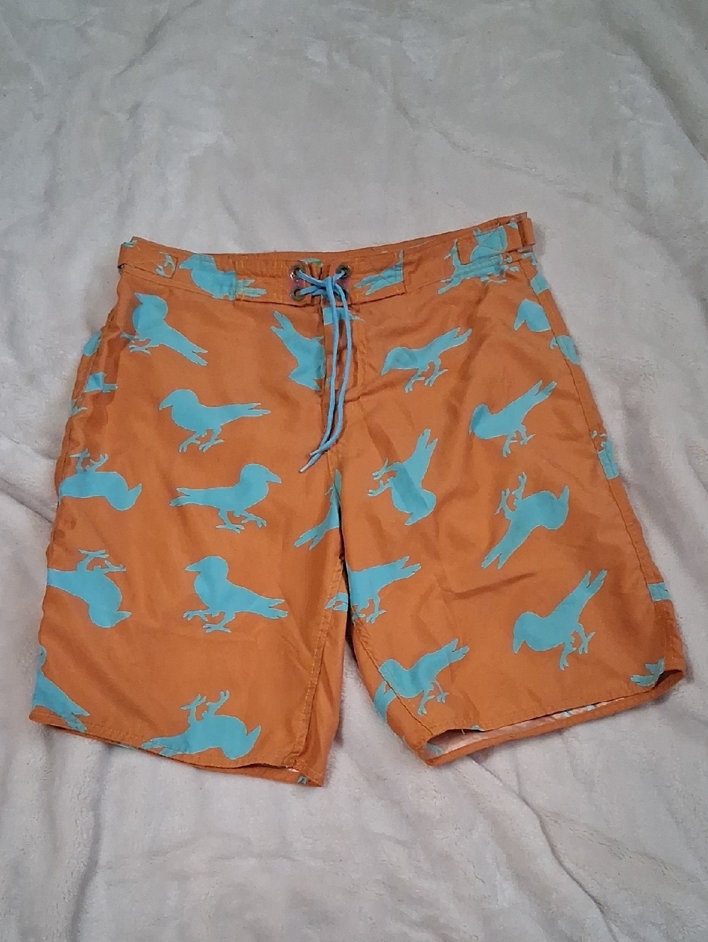 Modern Amusement Orange Swim Shorts with Light Blue Bird Print